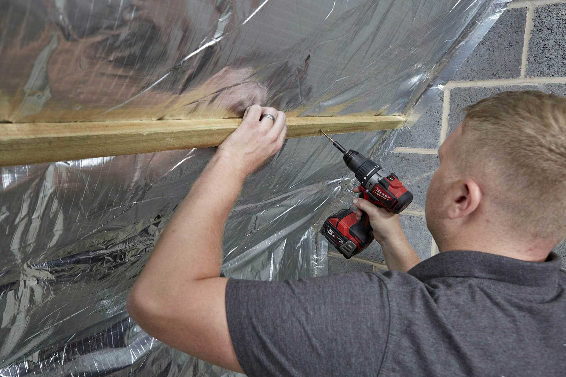KLR Loft Insulation & Dormer Installations screwing batons to superquilt insulation.
